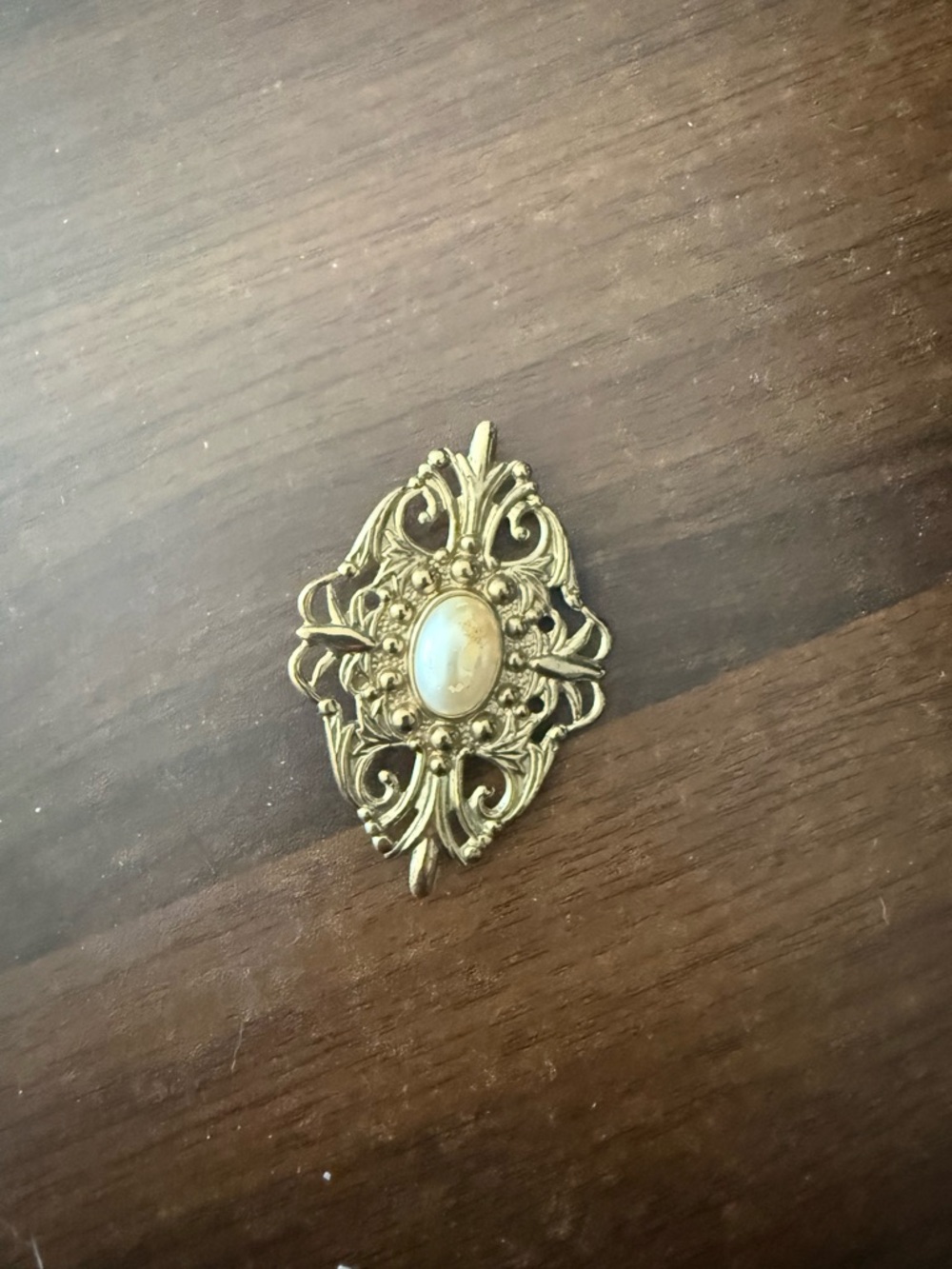 Gold-Tone Filigree Pendant with Oval Cabochon